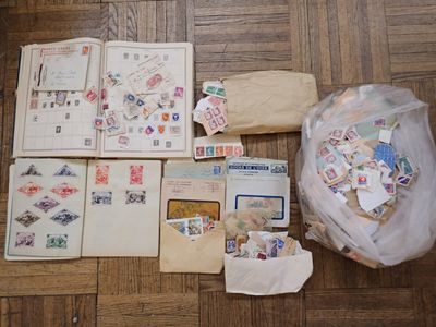 a bag of stamps and envelopes sitting on the floor