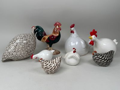 five different types of ceramic figurines sitting on a table
