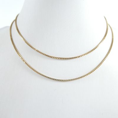 a gold chain necklace on a mannequin mannequin mannequin mannequin mannequin mannequin mannequin mannequin manne