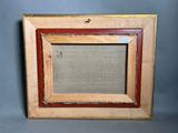 an old picture frame with a picture of a cat in it
