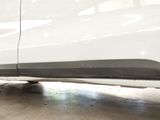 a white car that is parked in a garage