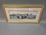 a picture of a picture of a picture of a city in a gold frame