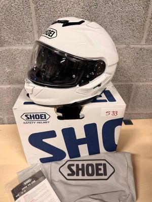 the helmet is sitting on top of the box on the table