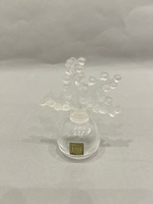 a small glass vase with bubbles in it