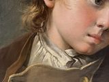 portrait of a young boy in a brown jacket and white shirt