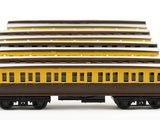 a lot of yellow and brown train cars on a white surface