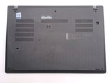 a laptop that is sitting on a white surface