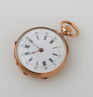 a gold pocket watch with roman numerals on it