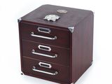 an image of a wooden file cabinet with three drawers