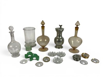 a lot of glass and metal items on a white surface