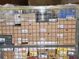 a large metal cage with many boxes on top of it