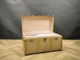 a suitcase that is sitting on the floor in front of a black background