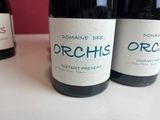 three bottles of wine that are on a table