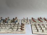 a lot of miniature figurines that are on a table