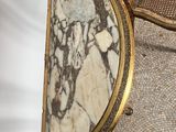 a gold frame with a picture of a woman on it