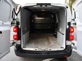 a white van with its doors open in a parking lot