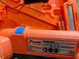 a close up of a plastic orange device on a table