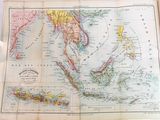 une vieille carte des Philippines et les Philippines posées sur une table