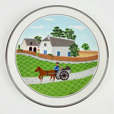 une assiette sur laquelle est représenté un homme dans une calèche