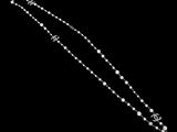 a close up of a necklace on a black background