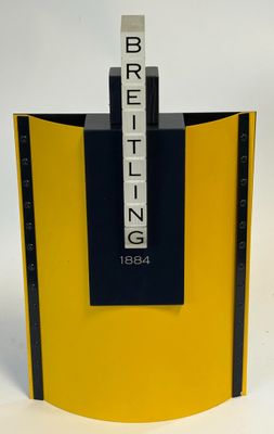 yellow and black bookend with the word britting on it