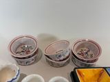 many bowls and bowls sitting on a white table