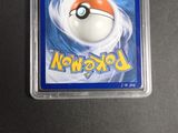 a close up of a pokemon trading card in a plastic holder