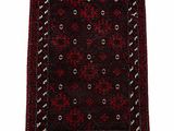 a red and black rug on a white background