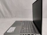 the back of a laptop computer sitting on top of a white table