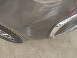 a close up of a car ' s front bumper and fender