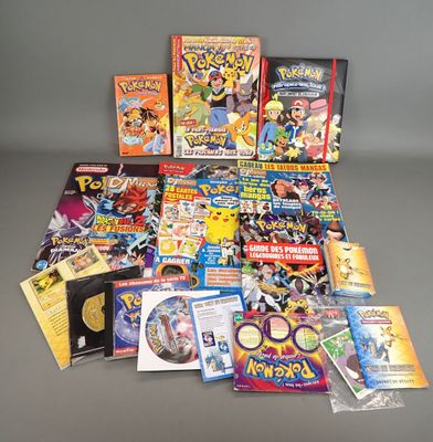 a lot of pokemon books and dvds on the table