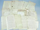 a pile of old papers sitting on top of a blue surface