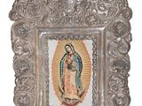ornate silver frame with a picture of the virgin of guadalupe