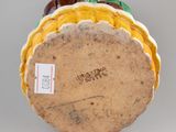 an image of a ceramic figurine of a taco on a white surface
