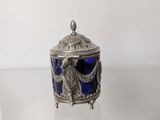a silver and blue glass box sitting on top of a table