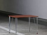 an image of a wooden table with metal legs