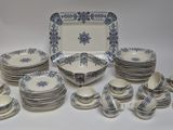 a lot of plates and cups on the table