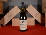 a bottle of wine that is sitting on a table
