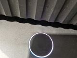 a ring on the floor of a room with a fan