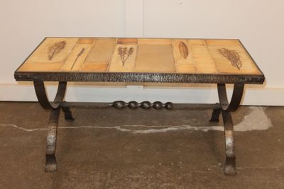 a wooden table with metal legs and a wooden table top