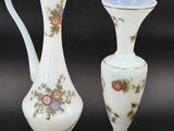 two vases sitting next to each other on a table