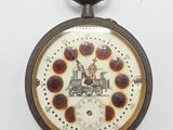 a pocket watch that has a clock on the front of it