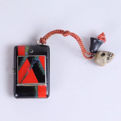 a cell phone that has a red and black design on it
