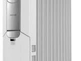 a white electric heater sitting on top of a white table