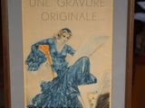 a framed picture of a woman in a blue dress