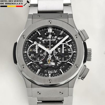 the watch is made of stainless steel and has a black dial