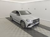 the mercedes gle suv is parked in a clean garage
