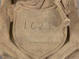 statue of a woman holding a shield with a horse on it ' s back