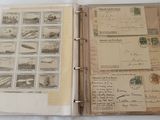 an open book with stamps on it sitting on a table