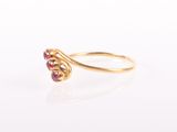 an image of a gold ring with a ruby stone
